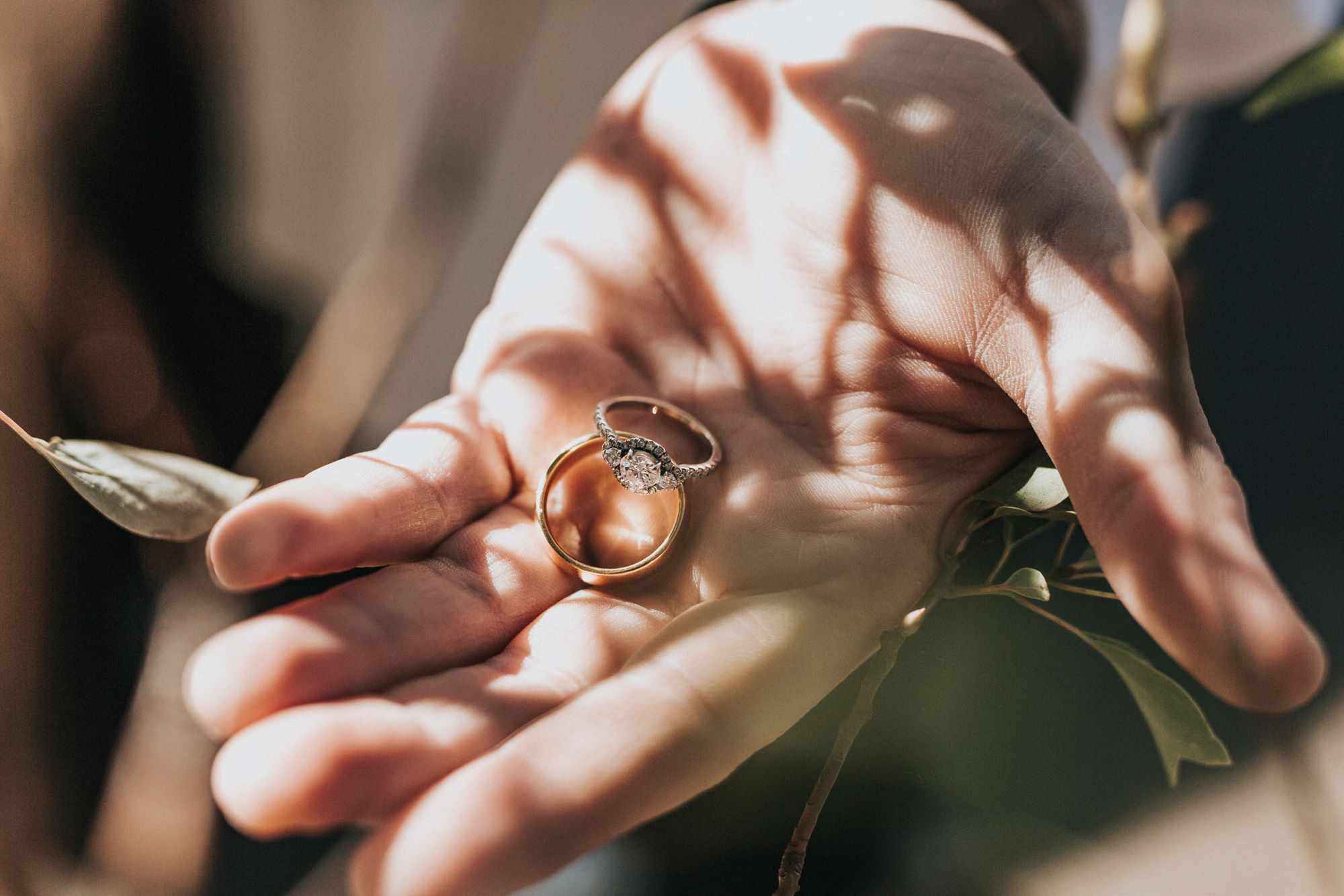 Hand-with-Two-Engagement-Rings-in-The-Palm